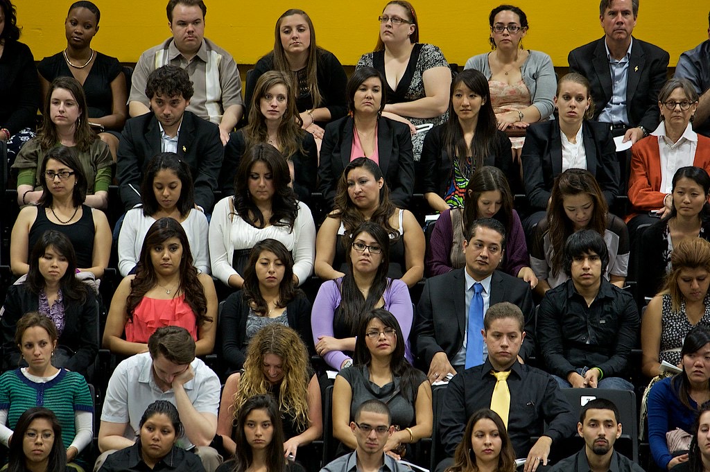 Rows of graduating students seated at a United States commencement ceremony