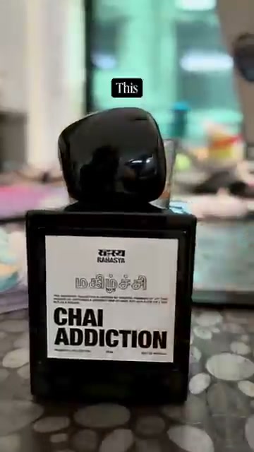 Chai Addiction bottle held in hand