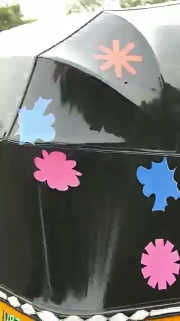 Decorated rickshaw canopy on a London street